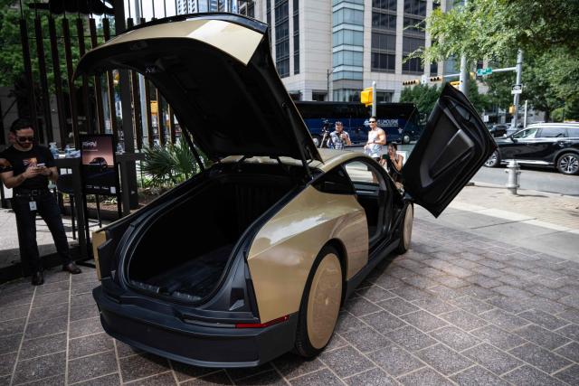 A Tesla's "Cybercab" is displayed in downtown Austin, Texas, on September 3, 2026. Tesla is launching the "Cybercab" which is a taxi with no steering wheel or pedals, designed purely for autonomy. (Photo by RONALDO SCHEMIDT / AFP)