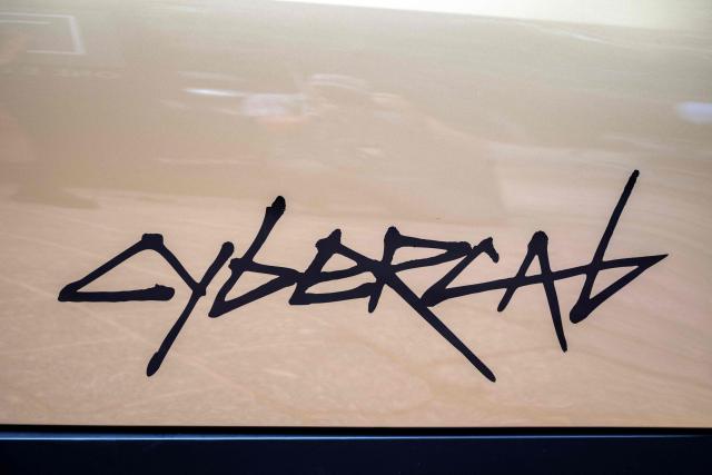 A Tesla's "Cybercab" (detail) is displayed in downtown Austin, Texas, on September 3, 2026. Tesla is launching the "Cybercab" which is a taxi with no steering wheel or pedals, designed purely for autonomy. (Photo by RONALDO SCHEMIDT / AFP)
