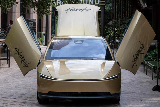 A Tesla's "Cybercab" is displayed in downtown Austin, Texas, on September 3, 2026. Tesla is launching the "Cybercab" which is a taxi with no steering wheel or pedals, designed purely for autonomy. (Photo by RONALDO SCHEMIDT / AFP)