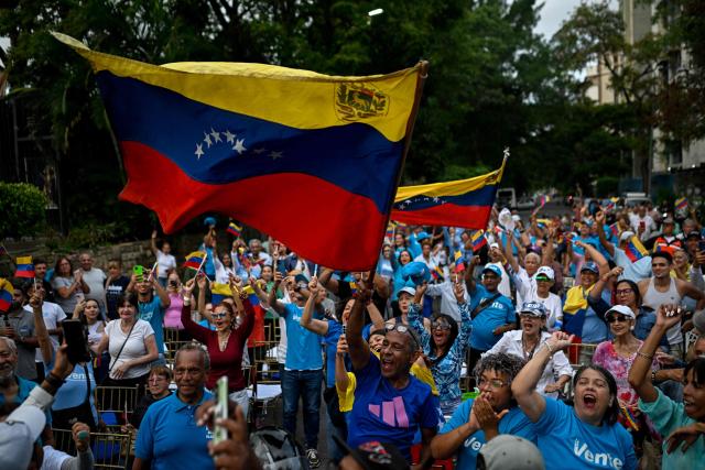 Supporters of Venezuelan opposition leader Maria Corina Machado take part in a citizen assembly calling for presidential elections in the La Vega neighborhood of Caracas on September 3, 2026. Venezuelan opposition figure Maria Corina Machado on September 3 called for a democratic transition in her country after the interim government struck a massive oil deal with the United States. (Photo by Federico PARRA / AFP)