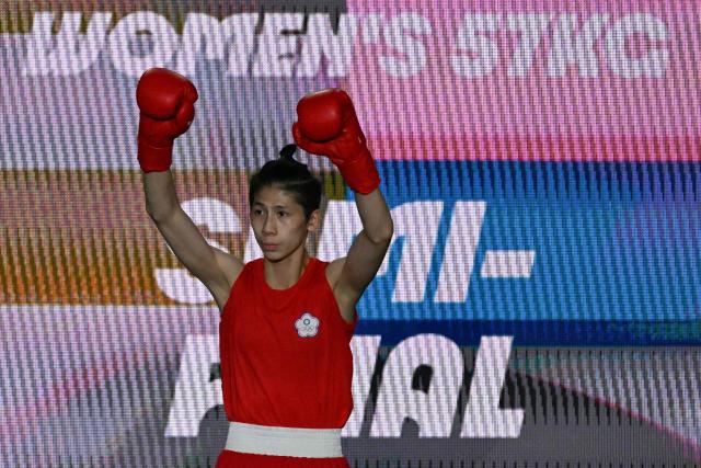(FILES) Taiwan's Lin Yu-ting arrives to fight Turkey's Esra Yildiz Kahraman in the women's 57kg semi-final boxing match during the Paris 2024 Olympic Games at the Roland-Garros Stadium, in Paris on August 7, 2024. Taiwanese boxer Lin Yu-ting told AFP she considered retiring after winning gold at the Paris Olympics but wanted to carry on fighting in part to defy those who questioned her eligibility. (Photo by MOHD RASFAN / AFP)