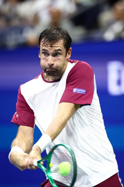 France's Quentin Halys hits a return during the men's singles second round tennis match against Germany's Alexander Zverev on day five of the US Open tennis tournament at the USTA Billie Jean King National Tennis Center in New York City on September 3, 2026. (Photo by CHARLY TRIBALLEAU / AFP)