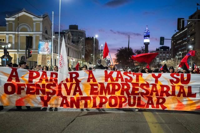 Demonstrators holds a sign against the Madrid Forum, a meeting of Latin American right-wing leaders, in Santiago on September 3, 2026. (Photo by Eduardo Vasquez / AFP)