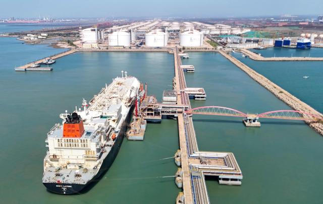 Gigira Laitebo tanker (L) unloads Liquefied Natural Gas (LNG) for Chinese state-owned oil and gas enterprise Sinopec, China Petroleum and Chemical Corporation in Qingdao, China's eastern Shandong province on September 3, 2026. (Photo by CN-STR / AFP) / China OUT