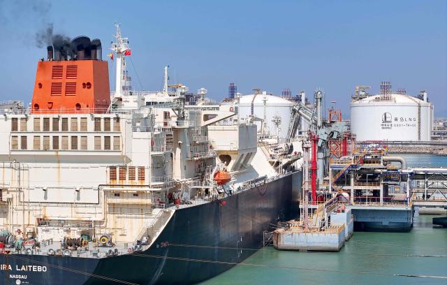 Gigira Laitebo tanker (L) unloads Liquefied Natural Gas (LNG) for Chinese state-owned oil and gas enterprise Sinopec, China Petroleum and Chemical Corporation in Qingdao, China's eastern Shandong province on September 3, 2026. (Photo by CN-STR / AFP) / China OUT