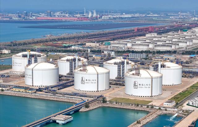 Tanks to store Liquefied Natural Gas (LNG) for Chinese state-owned oil and gas enterprise Sinopec, China Petroleum and Chemical Corporation, are seen in Qingdao, China's eastern Shandong province on September 3, 2026. (Photo by CN-STR / AFP) / China OUT