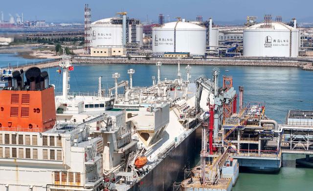 Gigira Laitebo tanker (L) unloads Liquefied Natural Gas (LNG) for Chinese state-owned oil and gas enterprise Sinopec, China Petroleum and Chemical Corporation in Qingdao, China's eastern Shandong province on September 3, 2026. (Photo by CN-STR / AFP) / China OUT
