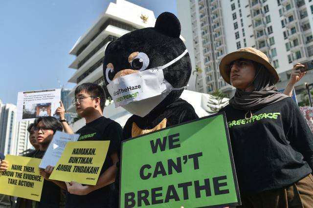 Activists gathered in front of the Indonesian embassy in Kuala Lumpur to submit an official memorandum calling for transparency and corporate accountability across borders on September 4,2026. Air quality in Malaysia deteriorated further from September 1, as smoke from Indonesian forest fires drove up respiratory complaints and sent residents scrambling for protective masks. (Photo by Arif Kartono / AFP)
