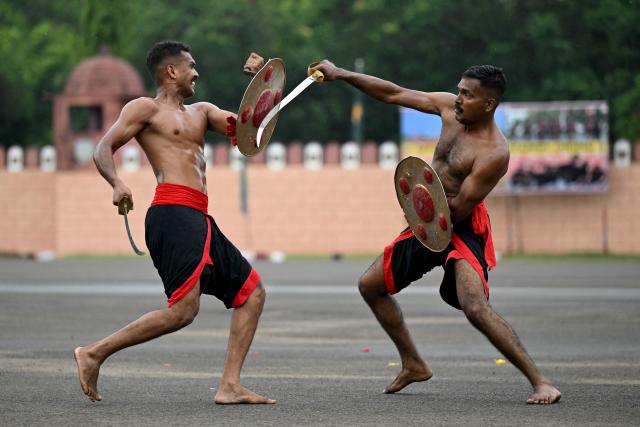 Indian army cadets perform Kalaripayattu martial arts during a military rehearsal ahead of a graduation ceremony at the Officers Training Academy in Chennai on September 4, 2026. (Photo by R.Satish BABU / AFP)