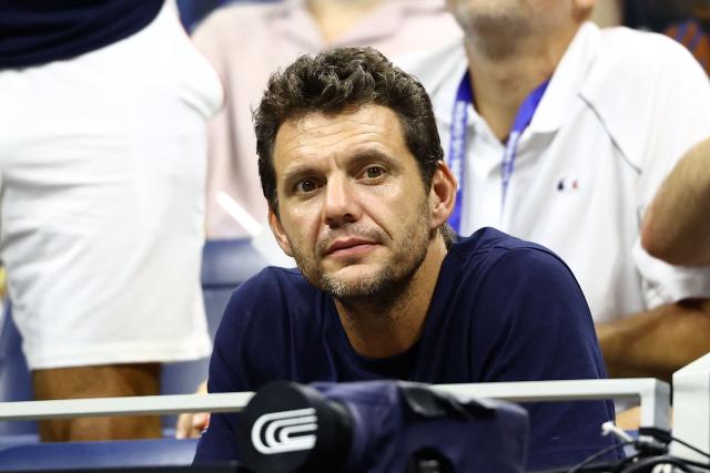 French former tennis player Paul-Henri Mathieu watches the men's singles second round tennis match between Germany's Alexander Zverev and France's Quentin Halys on day five of the US Open tennis tournament at the USTA Billie Jean King National Tennis Center in New York City on September 3, 2026. (Photo by CHARLY TRIBALLEAU / AFP)