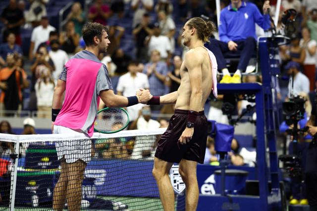 Germany's Alexander Zverev (R) shakes hands with France's Quentin Halys after their men's singles second round tennis match on day five of the US Open tennis tournament at the USTA Billie Jean King National Tennis Center in New York City on September 3, 2026. (Photo by CHARLY TRIBALLEAU / AFP)