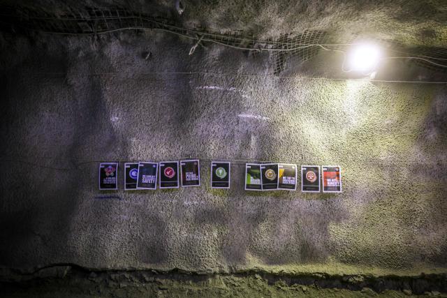 Posters adorn the wall of a tunnel near a workshop located in the underground CSA Cobar copper mine, operated by Harmony Gold Mining company, located north of the New South Wales town of Cobar on September 4, 2026. (Photo by DAVID GRAY / AFP)