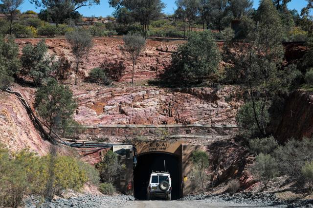 A truck enters the ‘porthole’ that leads to the underground CSA Cobar copper mine, operated by Harmony Gold Mining company, located north of the New South Wales town of Cobar on September 4, 2026. (Photo by DAVID GRAY / AFP)