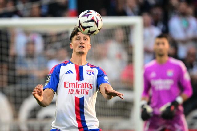 Lyon’s Austrian defender #20 Felix Bacher heads the ball during the French L1 football match between Olympique Lyonnais (OL) and AJ Auxerre at the Parc Olympique Lyonnais Groupama stadium in Decines-Charpieu, central-eastern France, on September 4, 2026. (Photo by OLIVIER CHASSIGNOLE / AFP)