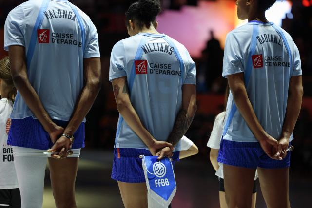 (L-R) France's center #14 Dominique Malonga, France's forward #15 Gabby Williams and France's center #22 Marieme Badiane line up prior to the 2026 FIBA Women's Basketball World Cup Group B match between Hungary and France at the Berlin Arena in Berlin on September 4, 2026. (Photo by Odd ANDERSEN / AFP)
