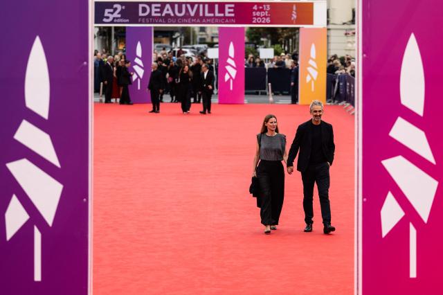 French film director Martin Bourboulon (R) walks on the red carpet at the opening of the 52nd edition of the Deauville American film festival, in Deauville on September 4, 2026. (Photo by Guillaume SALIGOT / AFP)
