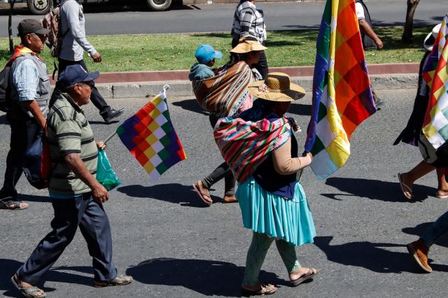 Coca growers from the Chapare region, supporters of former president Evo Morales, carry Wiphala flags as they take part in a protest march against the economic and social measures of President Rodrigo Paz's government, including an increase in diesel prices, in Cochabamba, Bolivia, on September 4, 2026. (Photo by David FLORES / AFP)