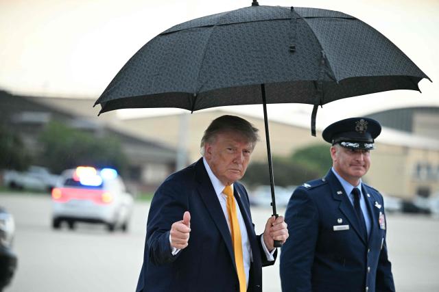 US President Donald Trump gives a thumbs up as he walks to board Air Force One at Joint Base Andrews, Maryland on September 4, 2026. Trump will be spending the weekend at his golf club in Bedminster, New Jersey. (Photo by Jim WATSON / AFP)