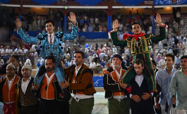 Spanish matador Carlos Perez (L) and Peruvian matador Pedro Luis (R) are carried in triumph after a bullfighting at Marcel Dangou arena, in Bayonne, southwestern France, on September 04, 2026. (Photo by Gaizka IROZ / AFP)
