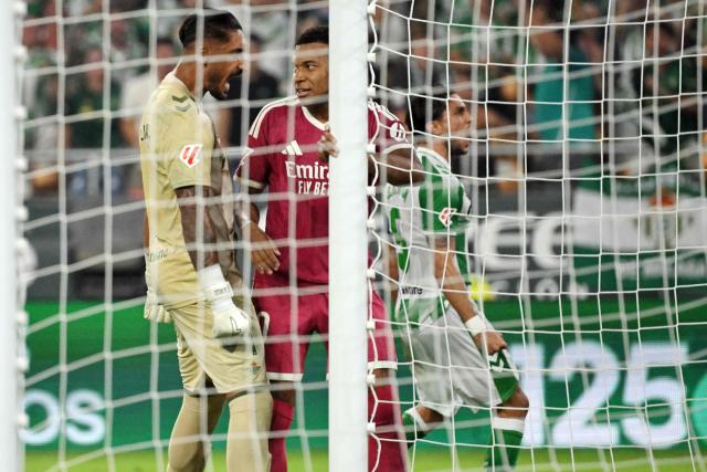 Real Betis' Spanish goalkeeper #01 Alvaro Valles (L) reacts after Real Madrid's French forward #10 Kylian Mbappe failed a penalty kick during the Spanish league football match between Real Betis and Real Madrid CF at Benito Villamarin Stadium in Seville on September 4, 2026. (Photo by JORGE GUERRERO / AFP)
