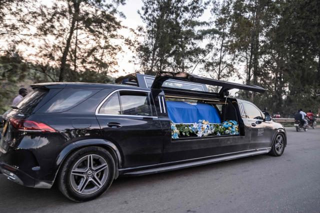 The hearse carrying the coffin of the late Ugandan King Oyo Nyimba Kabamba Iguru Rukidi IV travels along the route between Kyegegwa and Fort Portal on September 4, 2026. The body of Ugandan King Oyo Nyimba Kabamba Iguru Rukidi IV, recognised as the world's youngest reigning monarch, arrived back in Uganda following his death on August 27, 2026 in the United States at age 34. (Photo by Badru KATUMBA / AFP)