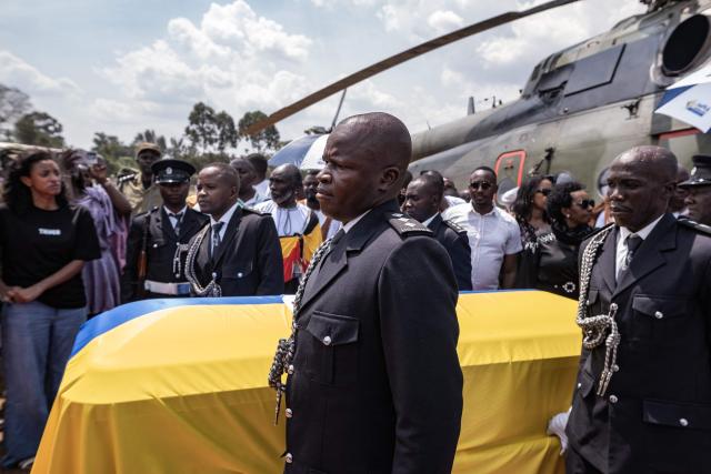 Members of the Tooro Kingdom royal clan, assisted by police and military officials, receive the remains of their late King Oyo Nyimba Kabamba Iguru Rukidi IV at Humura Playground in Kyegegwa on September 4, 2026. The body of Ugandan King Oyo Nyimba Kabamba Iguru Rukidi IV, recognised as the world's youngest reigning monarch, arrived back in Uganda following his death on August 27, 2026 in the United States at age 34. (Photo by Badru KATUMBA / AFP)