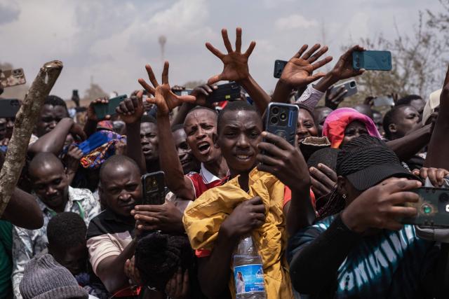 Members of the public react to the arrival of the remains of King Oyo Nyimba Kabamba Iguru Rukidi IV in Kyegegwa on September 4, 2026. The body of Ugandan King Oyo Nyimba Kabamba Iguru Rukidi IV, recognised as the world's youngest reigning monarch, arrived back in Uganda following his death on August 27, 2026 in the United States at age 34. (Photo by Badru KATUMBA / AFP)