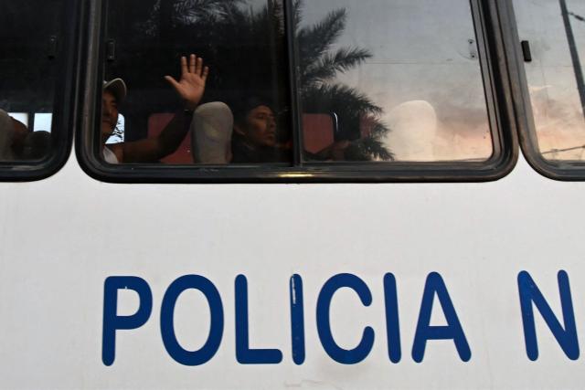 A group of detained fishermen are transported on a National Police bus to the Community Surveillance Unit (UVC) from the port of Manta, Ecuador, on September 4, 2026. The US military said on September 4 that it had blown up another boat allegedly linked to Ecuadoran drug gangs, bringing to three the number of vessels it has sunk in the area in the past week. (Photo by ARIEL OCHOA / AFP)
