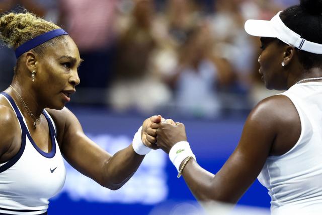 USA's Serena Williams (L) and Venus Williams bump fists during their women's doubles first-round tennis match against Australia's Maya Joint and Taiwan's Chan Hao-ching on day six of the US Open tennis tournament at the USTA Billie Jean King National Tennis Center in New York City on September 4, 2026. (Photo by CHARLY TRIBALLEAU / AFP)