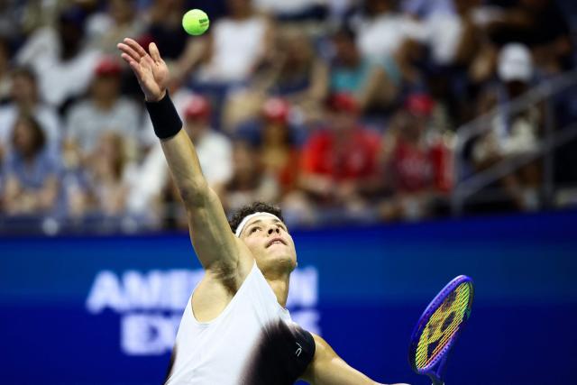 USA's Ben Shelton serves to Canada's Denis Shapovalov during the men's singles third round tennis match on day six of the US Open tennis tournament at the USTA Billie Jean King National Tennis Center in New York City on September 4, 2026. (Photo by CHARLY TRIBALLEAU / AFP)