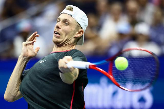 Canada's Denis Shapovalov returns the ball to USA's Ben Shelton during their men's singles third round tennis match on day six of the US Open tennis tournament at the USTA Billie Jean King National Tennis Center in New York City on September 4, 2026. (Photo by CHARLY TRIBALLEAU / AFP)