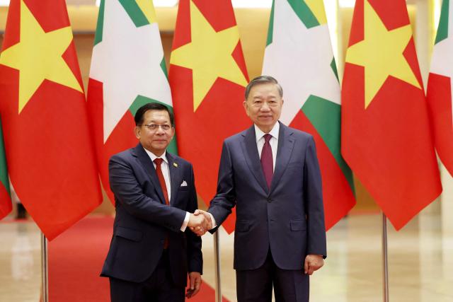 Vietnam's President To Lam (R) and Myanmar's President Min Aung Hlaing shake hands at the National Assembly House in Hanoi on September 5, 2026. (Photo by Quang Nguyen / AFP)