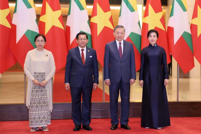 Vietnam's President To Lam (2nd R) and his wife Ngo Phuong Ly (R) poses for a group photo with Myanmar's President Min Aung Hlaing (2nd L) and his wife Kyu Kyu Hla (L) at the National Assembly House in Hanoi September 5, 2026. (Photo by Quang Nguyen / AFP)