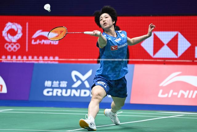 Japan's Akane Yamaguchi hits a return to South Korea's An Se-young during their women's singles semi-final match at the 2026 China Masters badminton tournament in Shenzhen, southern China's Guangdong province on September 5, 2026. (Photo by CN-STR / AFP) / China OUT