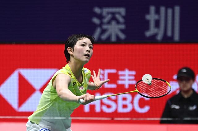 Japan's Tomoka Miyazaki hits a return to China's Wang Zhiyi during their women's singles semi-final match at the 2026 China Masters badminton tournament in Shenzhen, southern China's Guangdong province on September 5, 2026. (Photo by CN-STR / AFP) / China OUT