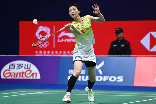 Japan's Tomoka Miyazaki hits a return to China's Wang Zhiyi during their women's singles semi-final match at the 2026 China Masters badminton tournament in Shenzhen, southern China's Guangdong province on September 5, 2026. (Photo by CN-STR / AFP) / China OUT