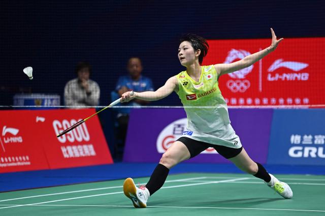 -Japan's Tomoka Miyazaki hits a return to China's Wang Zhiyi during their women's singles semi-final match at the 2026 China Masters badminton tournament in Shenzhen, southern China's Guangdong province on September 5, 2026. (Photo by CN-STR / AFP) / China OUT