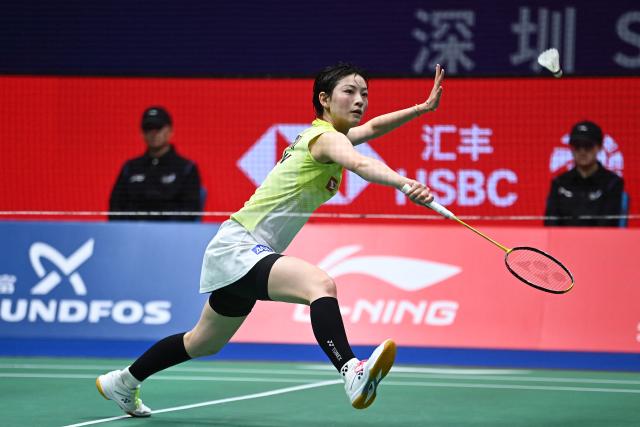 Japan's Tomoka Miyazaki hits a return to China's Wang Zhiyi during their women's singles semi-final match at the 2026 China Masters badminton tournament in Shenzhen, southern China's Guangdong province on September 5, 2026. (Photo by CN-STR / AFP) / China OUT