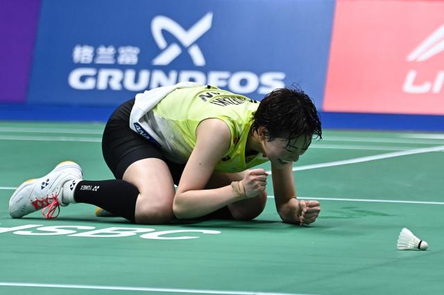 Japan's Tomoka Miyazaki celebrates after winning against China's Wang Zhiyi during their women's singles semi-final match at the 2026 China Masters badminton tournament in Shenzhen, southern China's Guangdong province on September 5, 2026. (Photo by CN-STR / AFP) / China OUT
