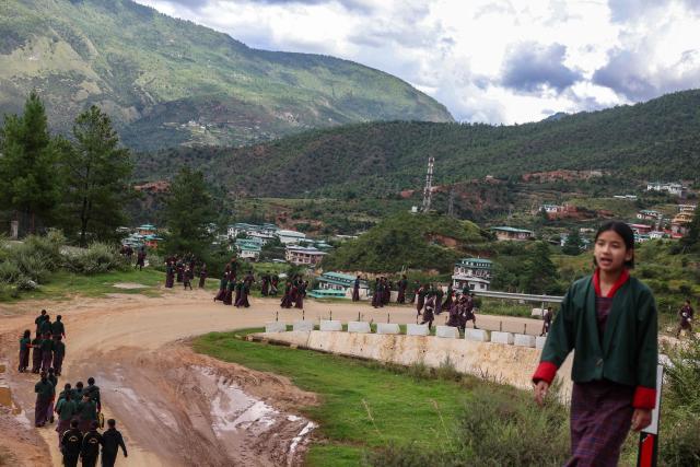 Students leave after attending their school in Paro, Bhutan on September 4, 2026. (Photo by Niharika KULKARNI / AFP)