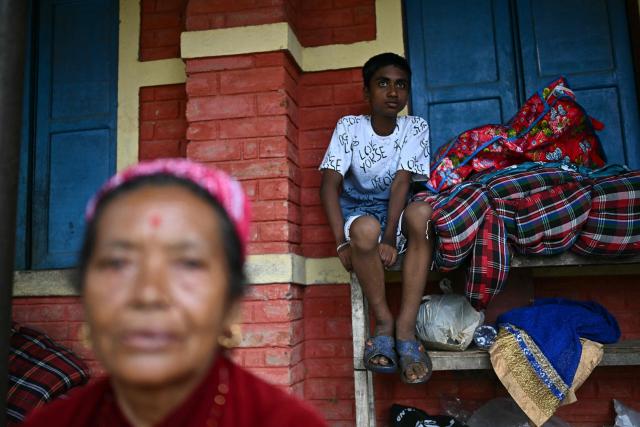 Flash flood survivors take shelter inside a temporary relief centre at Devghat in Nepal's Nuwakot district on September 5, 2026. (Photo by Pedro PARDO / AFP)