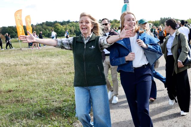 Swedish Center Party leader Elisabeth Thand Ringqvist (L) campaigns together with former party leader Annie Lööf at Gärdet in Stockholm, Sweden, on September 5, 2026, ahead of the general election to take place on September 13, 2026. (Photo by Stefan JERREVANG / TT News Agency / AFP) / Sweden OUT