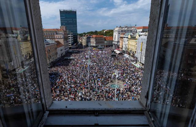Protesters gather on Ban Jelacic Square during a demonstration to demand action over the illegal dumping of hazardous waste in Croatia's Lika region, in Zagreb, on September 7, 2026. Thousands rallied in Zagreb seeking an immediate cleanup of thousands of tonnes of hazardous waste still unrecovered after years of illegal dumping in one of the country's most pristine regions, and to demand accountability for those responsible. (Photo by MARKO PERKOV / AFP)