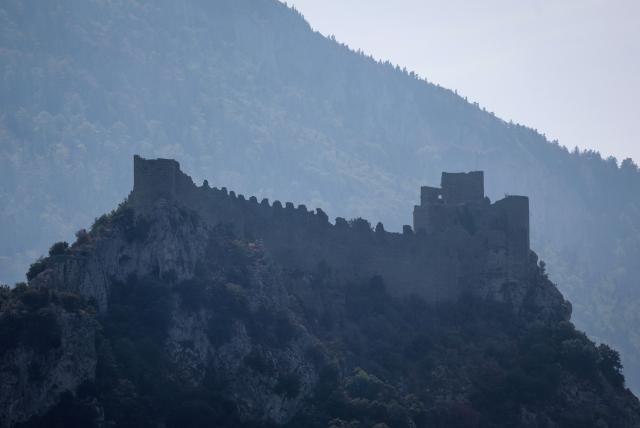 This photograph shows Puilaurens Castle shrouded in haze amid a forest fire in Puilaurens, southwestern France, on September 5, 2026. (Photo by Valentine CHAPUIS / AFP)