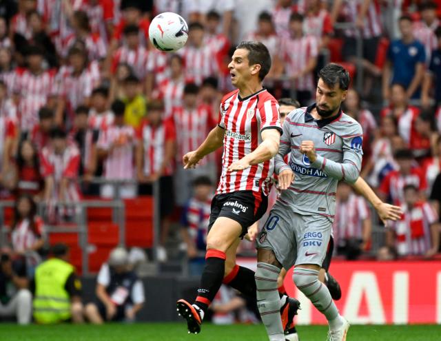 Athletic Bilbao's Spanish midfielder #16 Inigo Ruiz de Galarreta fights for the ball with Atletico Madrid's Spanish forward #10 Alex Baena during the Spanish league football match between Athletic Club Bilbao and Club Atletico de Madrid at San Mames Stadium in Bilbao on September 5, 2026. (Photo by ANDER GILLENEA / AFP)