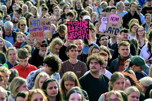 People, some with placards against the AFD, gather to demonstrate for an open society based on solidarity during a festival of democracy in Magdeburg, eastern Germany, on September 5, 2026, one day before regional elections in the eastern federal state of Saxony-Anhalt. Germany faces a landmark regional election on September 6, 2026 in the ex-communist east where the far-right Alternative for Germany (AfD) party is easily expected to win and has its sights on heading its first state government. While it is far from assured that Alternative for Germany will win enough votes to rule the state alone, topping the polls in Saxony-Anhalt state would heap pressure on Chancellor Friedrich Merz and spell another boost for the anti-immigration party. (Photo by John MACDOUGALL / AFP)