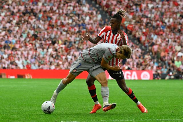 Atletico Madrid's South Korean midfielder #07 Kang-In Lee (L) vies for the ball with Athletic Bilbao's Spanish forward #10 Nico Williams during the Spanish league football match between Athletic Club Bilbao and Club Atletico de Madrid at San Mames Stadium in Bilbao on September 5, 2026. (Photo by ANDER GILLENEA / AFP)