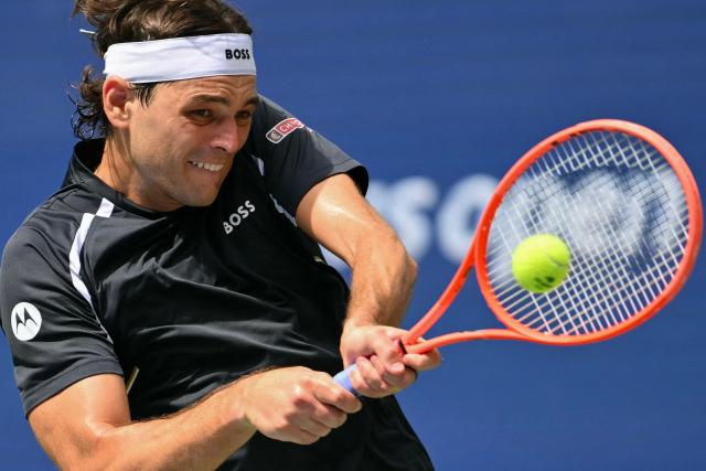 USA's Taylor Fritz hits a return to Argentina's Francisco Cerundolo during their men's singles third round tennis match on day seven of the US Open tennis tournament at the USTA Billie Jean King National Tennis Center in New York City on September 5, 2026. (Photo by ANGELA WEISS / AFP)