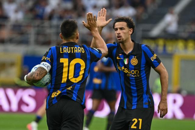 Inter Milan's Argentinian forward #10 Lautaro Martinez celebrates with Inter Milan's English midfielder #21 Curtis Jones after scoring his team's first goal during the Italian Serie A football match between Inter Milan and Napoli at the San Siro stadium in Milan on September 5, 2026. (Photo by Isabella BONOTTO / AFP)