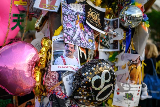 This photograph shows messages and tributes attached to the iconic Freddie Mercury statue overlooking Lake Geneva during Montreux Freddie Day, marking the 80th anniversary of the birth of the Queen frontman, in Montreux, Switzerland, on September 5, 2026. (Photo by Fabrice COFFRINI / AFP)